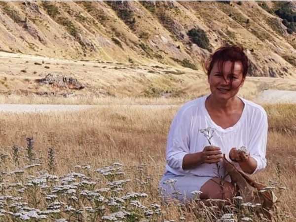 Elena Turner with field of yarrow (Achillea millefolium)